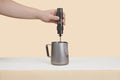 Frothing milk with the OutIn LattoGo in Tundra Brown